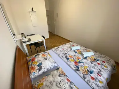 Łóżko lub łóżka w pokoju w obiekcie Fantastic-Inn Warszawa - Ordynacka