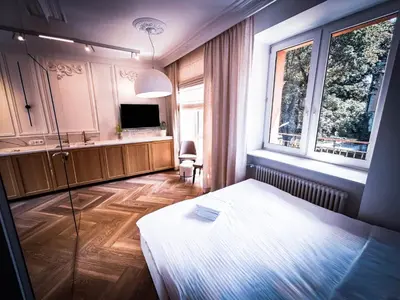 Łóżko lub łóżka w pokoju w obiekcie Center Deluxe Art
