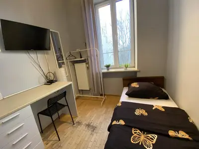 Łóżko lub łóżka w pokoju w obiekcie Fantastic-Inn Warszawa - Górskiego