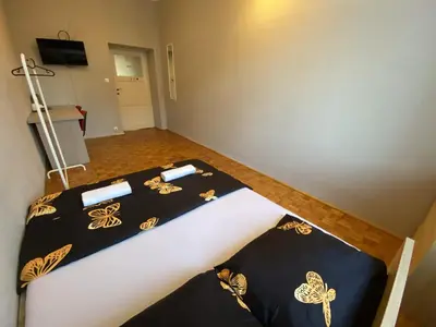 Łóżko lub łóżka w pokoju w obiekcie Fantastic-Inn Warszawa - Górskiego