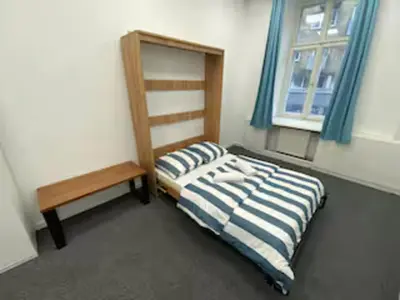Łóżko lub łóżka w pokoju w obiekcie Fantastic-Inn Warszawa - Górskiego