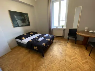 Łóżko lub łóżka w pokoju w obiekcie Fantastic-Inn Warszawa - Górskiego