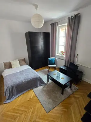 Łóżko lub łóżka w pokoju w obiekcie Apartamenty-MI Mariensztat