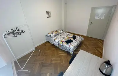 Łóżko lub łóżka w pokoju w obiekcie Fantastic-Inn Warszawa - NS25
