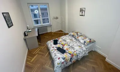 Łóżko lub łóżka w pokoju w obiekcie Fantastic-Inn Warszawa - NS25