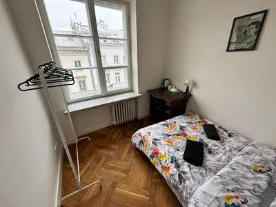Łóżko lub łóżka w pokoju w obiekcie Fantastic-Inn Warszawa - NS25
