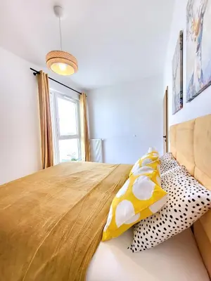 Łóżko lub łóżka w pokoju w obiekcie Ursus Premium Apartments