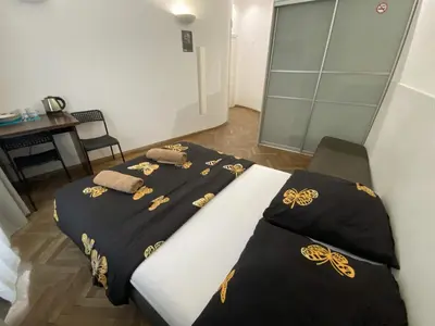 Łóżko lub łóżka w pokoju w obiekcie Fantastic-Inn Warszawa - Okólnik