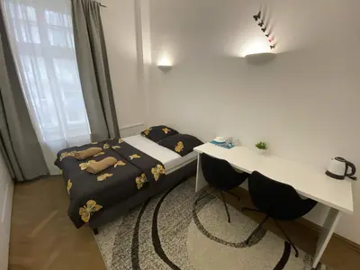Łóżko lub łóżka w pokoju w obiekcie Fantastic-Inn Warszawa - Okólnik