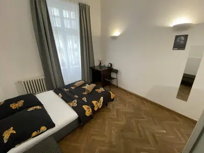 Łóżko lub łóżka w pokoju w obiekcie Fantastic-Inn Warszawa - Okólnik