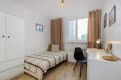 Łóżko lub łóżka w pokoju w obiekcie SuperApart Prosta 2 ROOMS