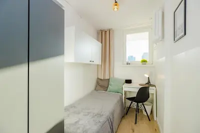 Łóżko lub łóżka w pokoju w obiekcie SuperApart Prosta 2 ROOMS