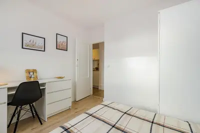 Łóżko lub łóżka w pokoju w obiekcie SuperApart Prosta 2 ROOMS
