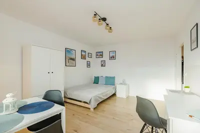 Łóżko lub łóżka w pokoju w obiekcie SuperApart Prosta 2 ROOMS
