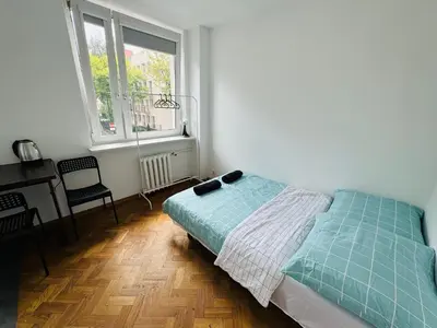 Łóżko lub łóżka w pokoju w obiekcie Fantastic-Inn Warszawa - Szczygla
