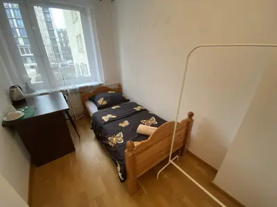Łóżko lub łóżka w pokoju w obiekcie Fantastic-Inn Warszawa - Szczygla