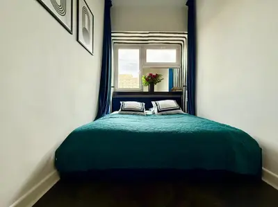 Łóżko lub łóżka w pokoju w obiekcie MOOD58 Apartment Warsaw