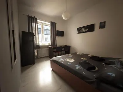 Łóżko lub łóżka w pokoju w obiekcie Fantastic-Inn Warszawa - NS54