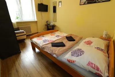 Łóżko lub łóżka w pokoju w obiekcie Fantastic-Inn Warszawa - NS54