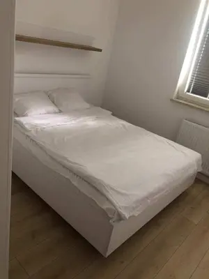 Łóżko lub łóżka w pokoju w obiekcie Airport Apartment Okęcie