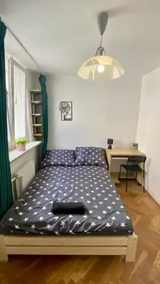Łóżko lub łóżka w pokoju w obiekcie Rooms in Warsaw - K3 - 2