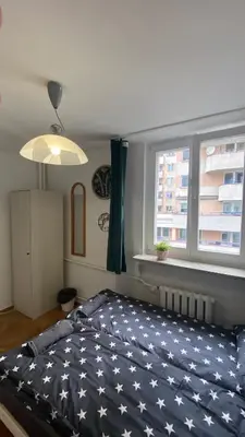 Łóżko lub łóżka w pokoju w obiekcie Rooms in Warsaw - K3 - 2