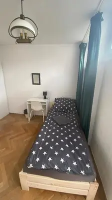 Łóżko lub łóżka w pokoju w obiekcie Rooms in Warsaw - K3 - 2
