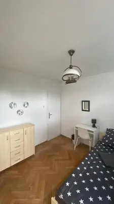Łóżko lub łóżka w pokoju w obiekcie Rooms in Warsaw - K3 - 2