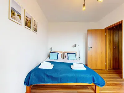 Łóżko lub łóżka w pokoju w obiekcie Flora Apartment Ursynow 2 Bedrooms & Parking