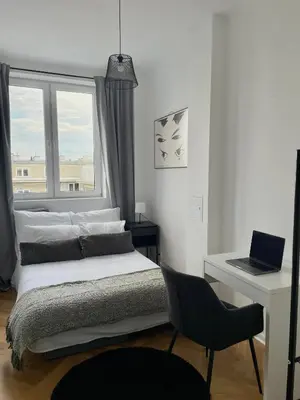 Łóżko lub łóżka w pokoju w obiekcie Apartament Muranów