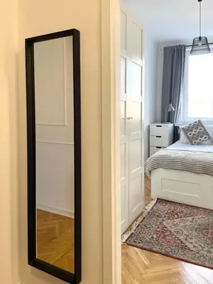 Łóżko lub łóżka w pokoju w obiekcie Apartament Muranów