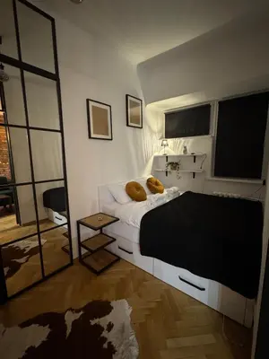 Łóżko lub łóżka w pokoju w obiekcie Central Warsaw 2 Room Flat