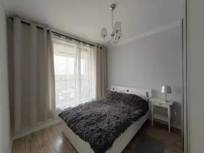 Łóżko lub łóżka w pokoju w obiekcie Warszawa Apartament Klimczaka 6