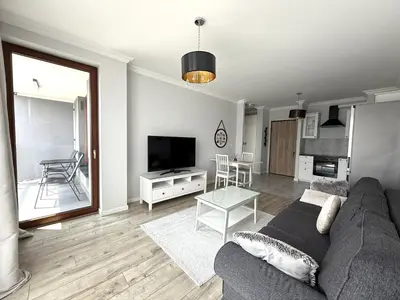 Telewizja i/lub zestaw kina domowego w obiekcie Warszawa Apartament Klimczaka 6