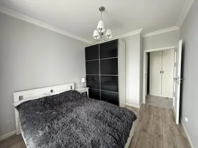 Łóżko lub łóżka w pokoju w obiekcie Warszawa Apartament Klimczaka 6