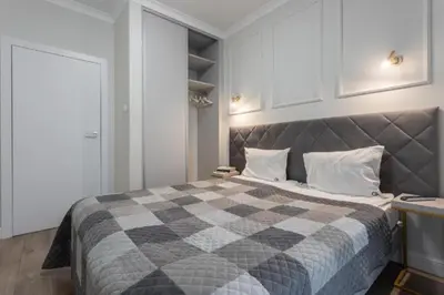 Łóżko lub łóżka w pokoju w obiekcie Urban Chic - Luxury Stay for up to 15 Guests in Mennica Residence, Warsaw Center