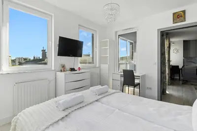 Łóżko lub łóżka w pokoju w obiekcie Pełczyńskiego Comfort Stay by Solarento