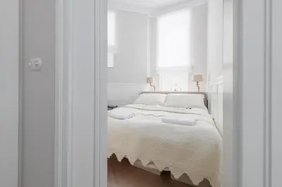 Łóżko lub łóżka w pokoju w obiekcie Śródmieście Piękna Comfort Apartments