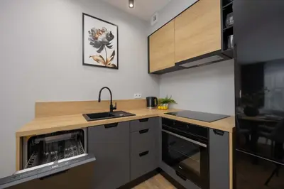 Kuchnia lub aneks kuchenny w obiekcie Komfortowe Rodzinne Studio Okrzei Warszawa by Noclegi Renters