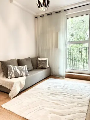 Łóżko lub łóżka w pokoju w obiekcie Studio obok metra! Apartamenty LoftWola