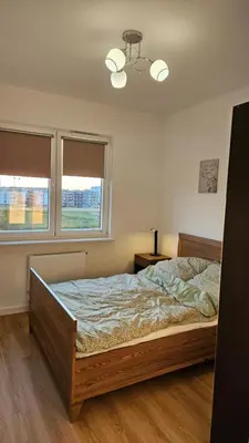 Łóżko lub łóżka w pokoju w obiekcie Bemowo Apartment