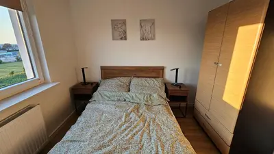 Łóżko lub łóżka w pokoju w obiekcie Bemowo Apartment