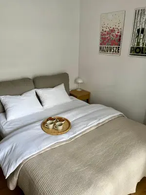 Łóżko lub łóżka w pokoju w obiekcie Pauline Apartments