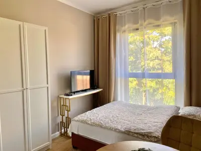 Łóżko lub łóżka w pokoju w obiekcie Apartament Motyl