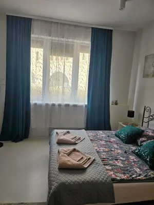 Łóżko lub łóżka w pokoju w obiekcie Warszawski Sen