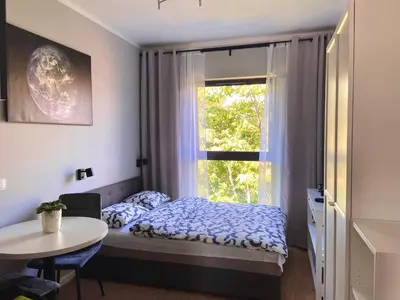 Łóżko lub łóżka w pokoju w obiekcie Apartament Planeta