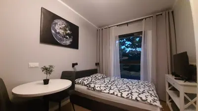 Łóżko lub łóżka w pokoju w obiekcie Apartament Planeta