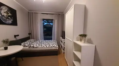 Łóżko lub łóżka w pokoju w obiekcie Apartament Planeta