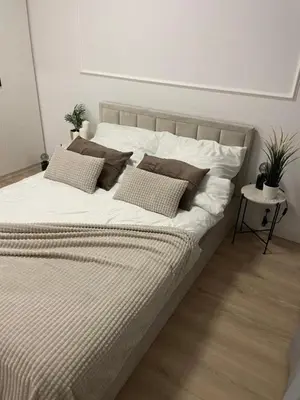 Łóżko lub łóżka w pokoju w obiekcie Green Airport Apartment
