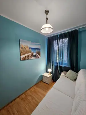 Łóżko lub łóżka w pokoju w obiekcie 3 pokoje koło Parku przy Żwirki
